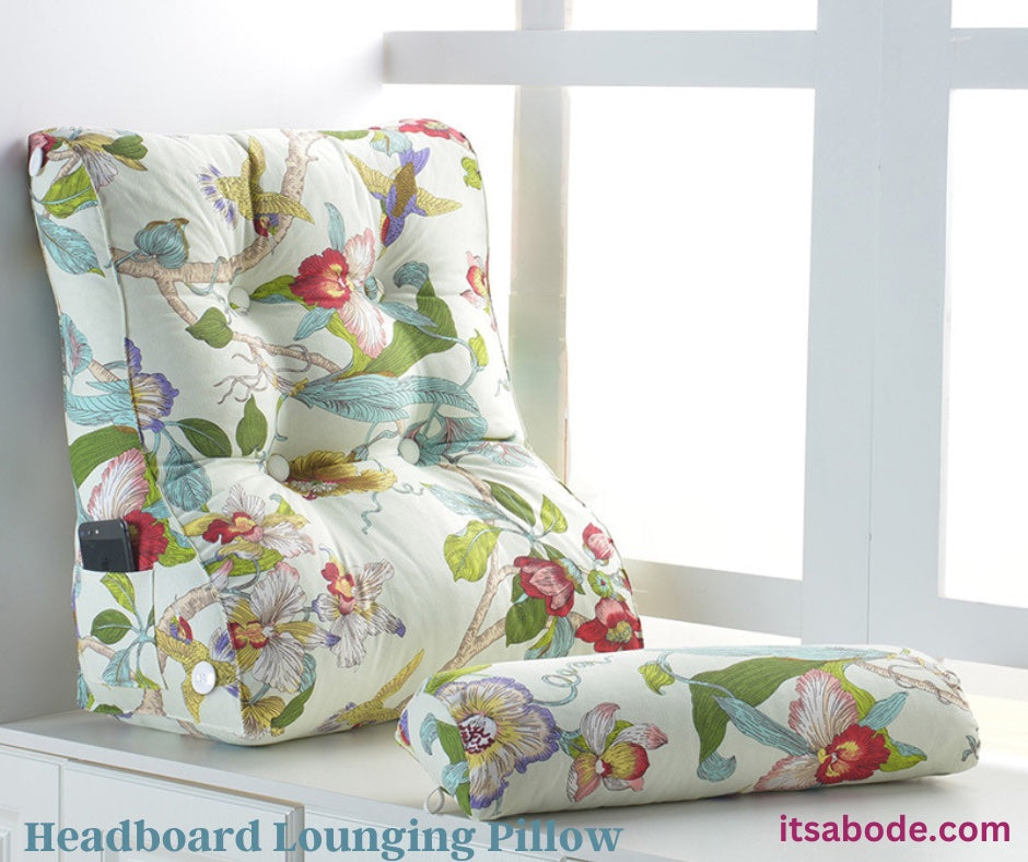 Floral patterned headboard lounging pillow resting against wall