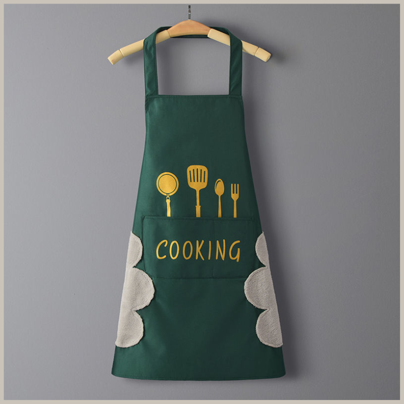 Kitchen apron. Green with gold utensils across front. Side hand wiping patches on each side. Front pocket with the word cooking across it.
