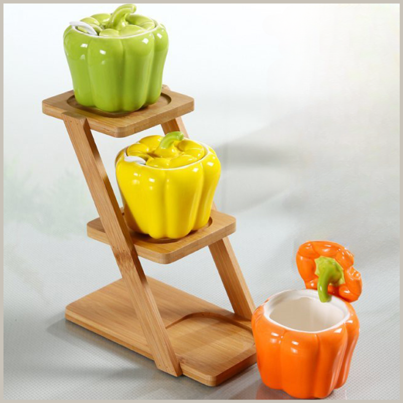 Ceramic Pepper Seasoning Jar Set sitting on a wooden ladder tray. 