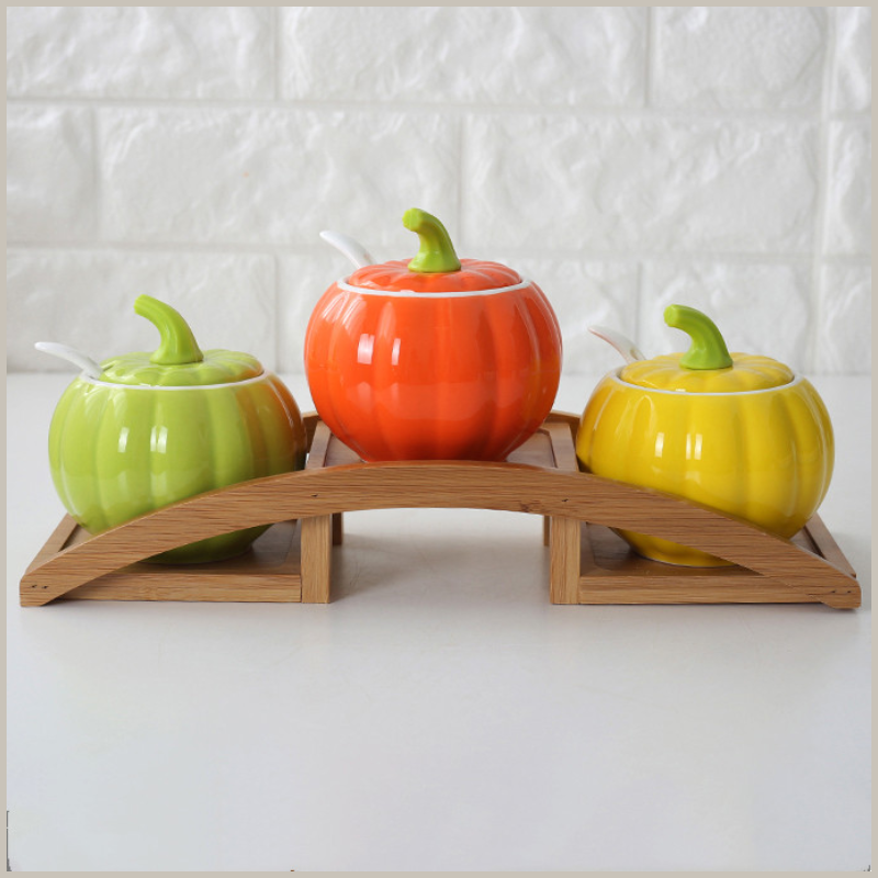 Ceramic Gourd Seasoning Jar Set sitting on wooden arched tray. 